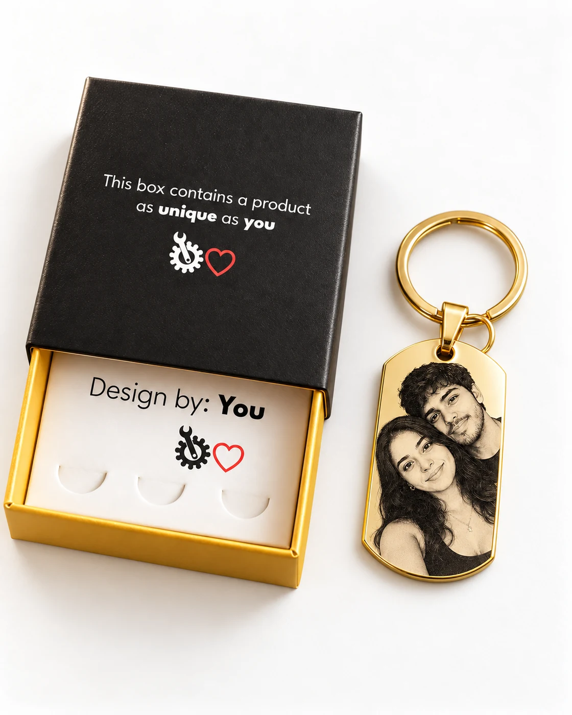 Illustrative gift presentation with the Custom Love black and gold box, its white insert, one personalized gold keychain and keyring hardware