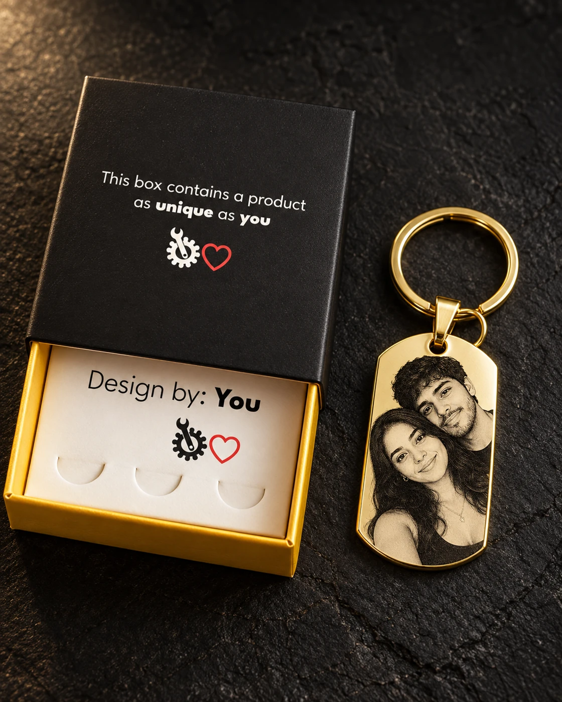 Illustrative gift presentation with the Custom Love black and gold box, its white insert, one personalized gold keychain and keyring hardware